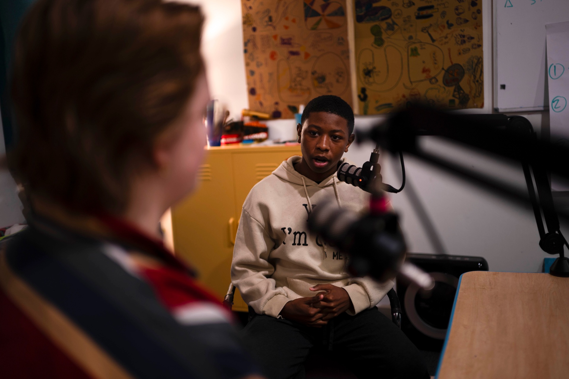 Teen being interviewed on mic