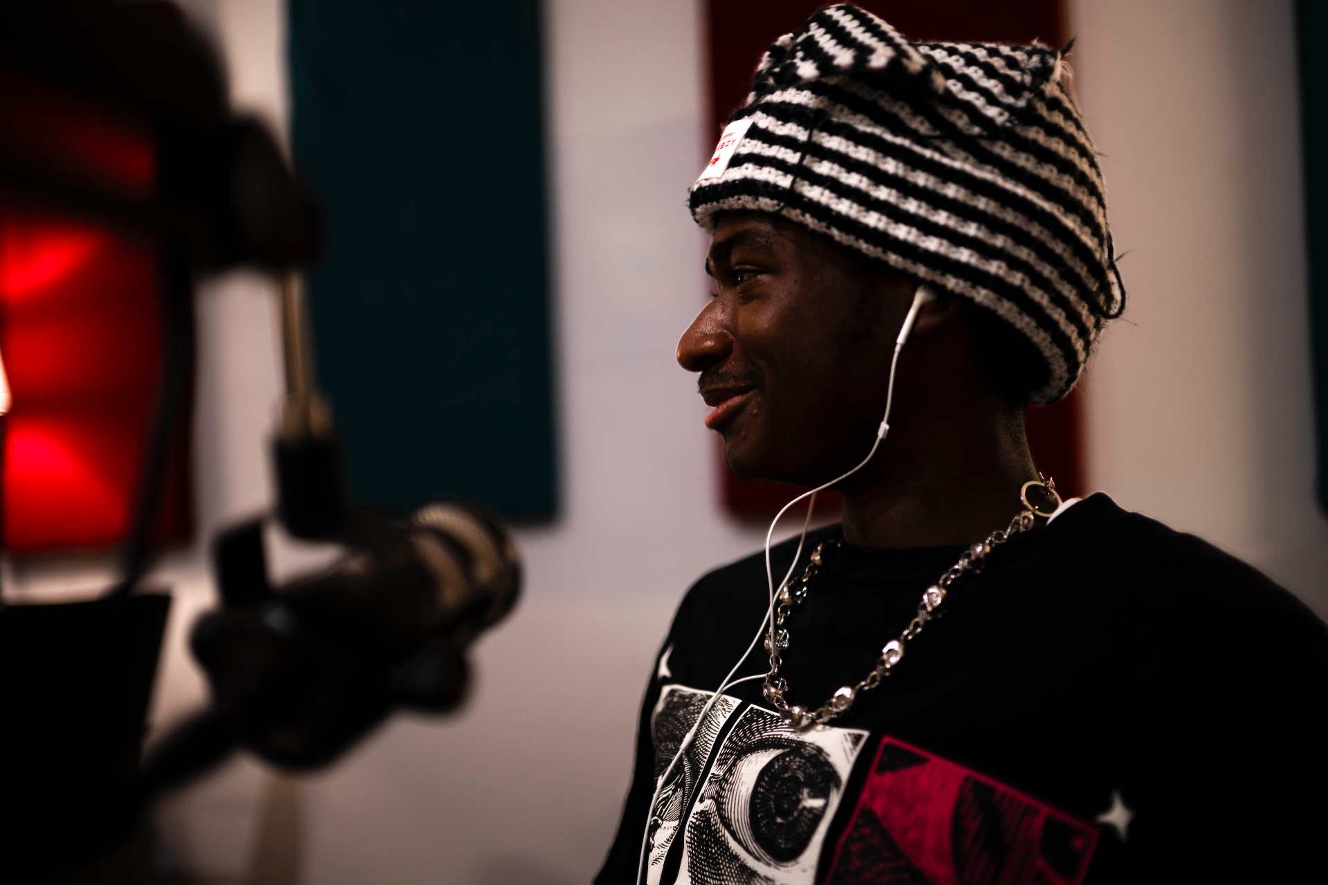 Teen recording on mic in the studio